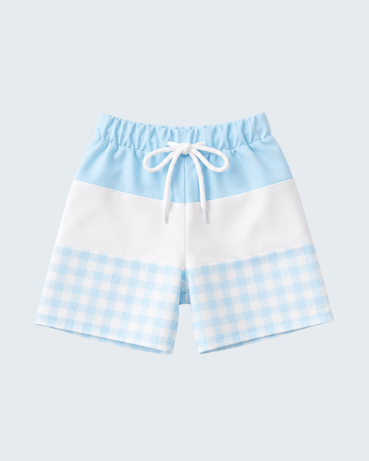 Color-blocked shorts with a checkered pattern on a light blue background