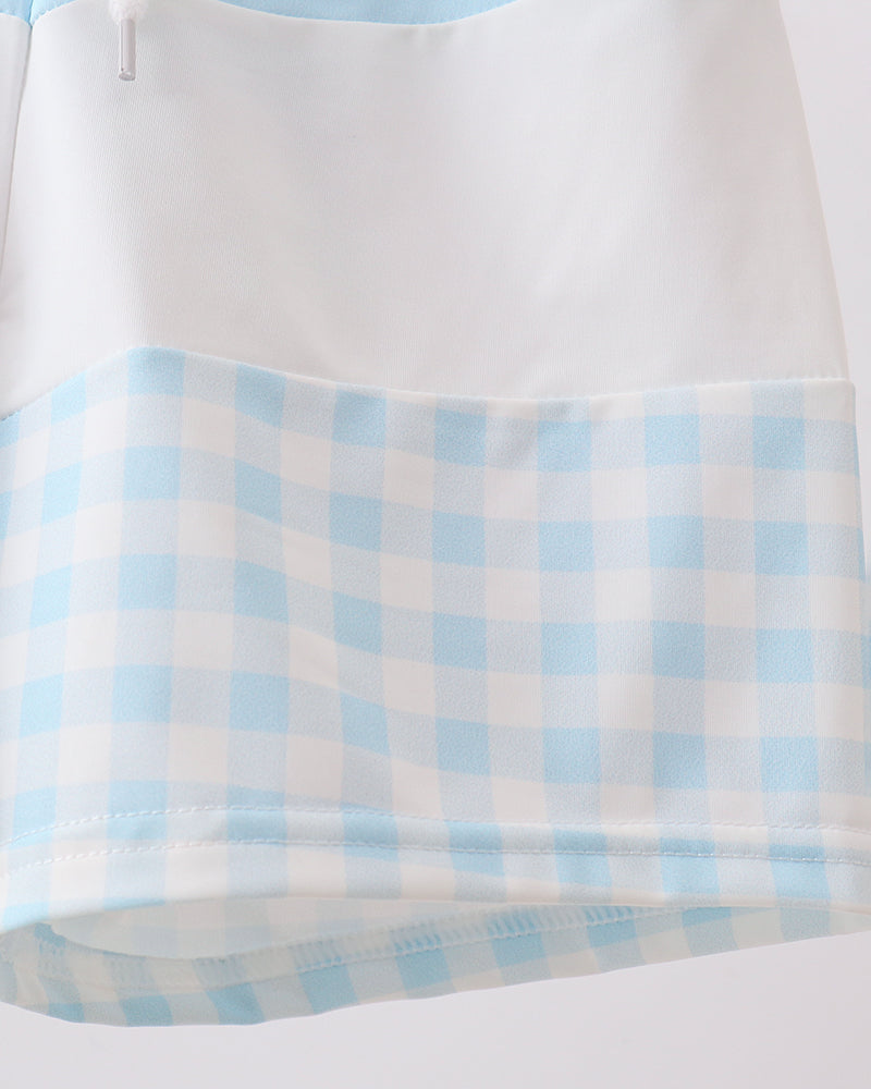 Light blue and white checkered fabric on a white background