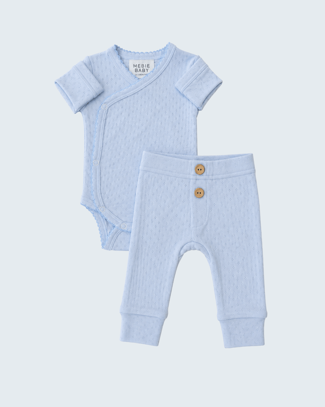 Light blue pointelle baby layette set: short-sleeve bodysuit and button-front pants