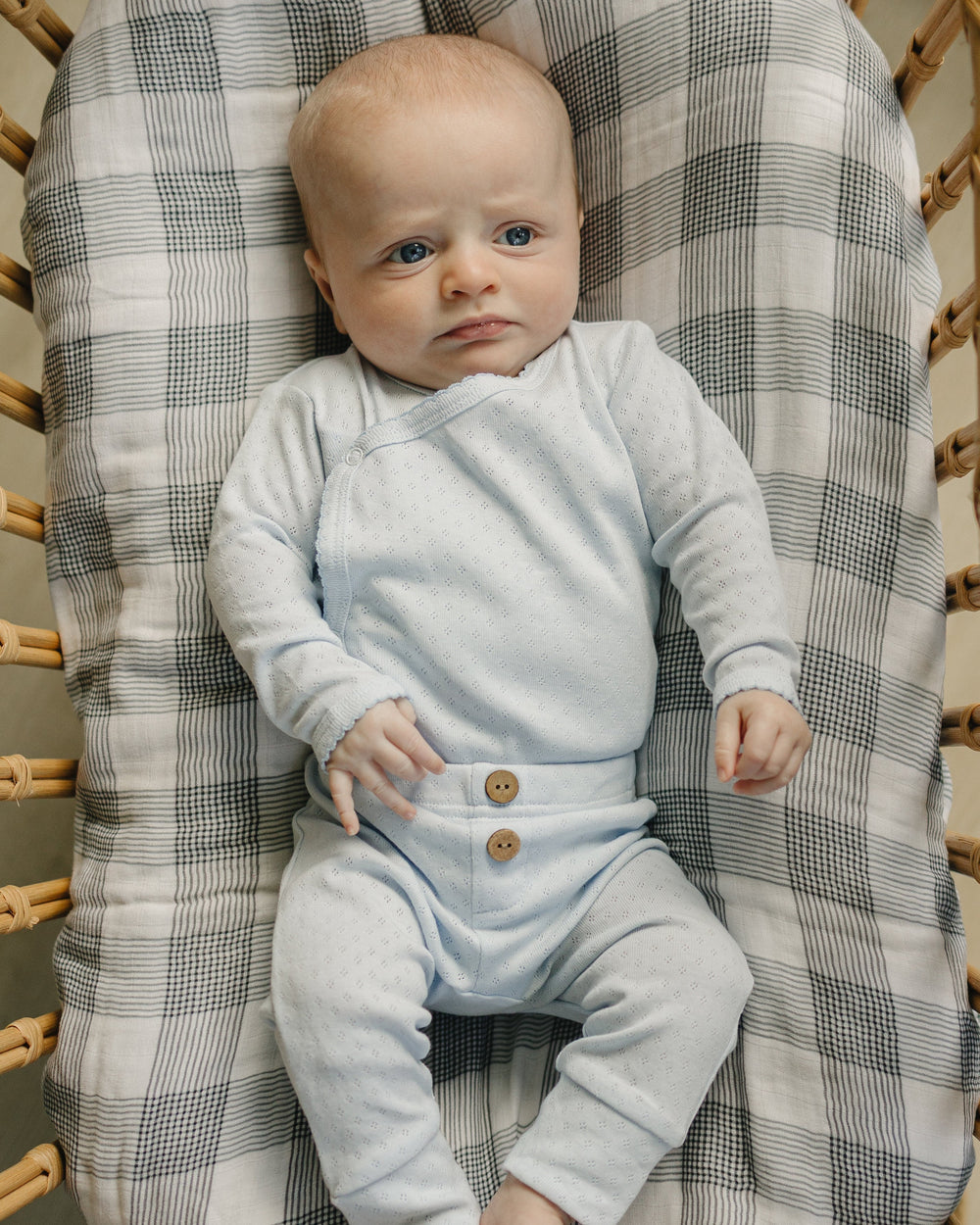 Light gray baby layette outfit with long-sleeve top and button-front pants