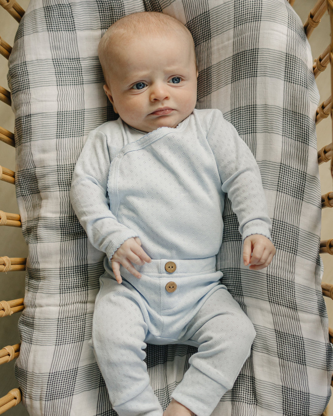 Light gray baby layette outfit with long-sleeve top and button-front pants