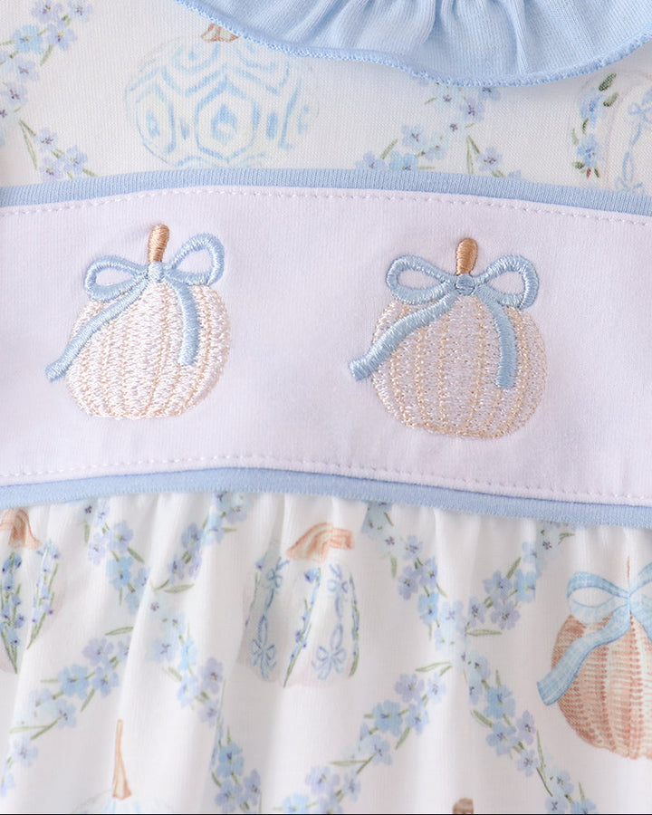 Blue-and-white bubble romper yoke with two pumpkin embroidery appliques and ruffle trim
