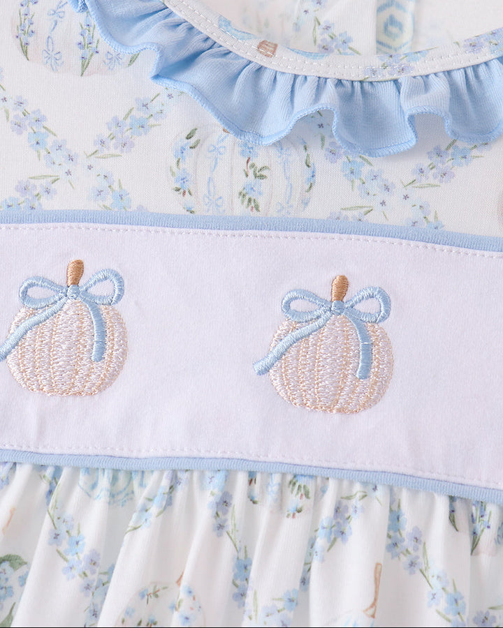 Embroidered pumpkin appliques on light blue band with ruffled neckline and skirt hem.