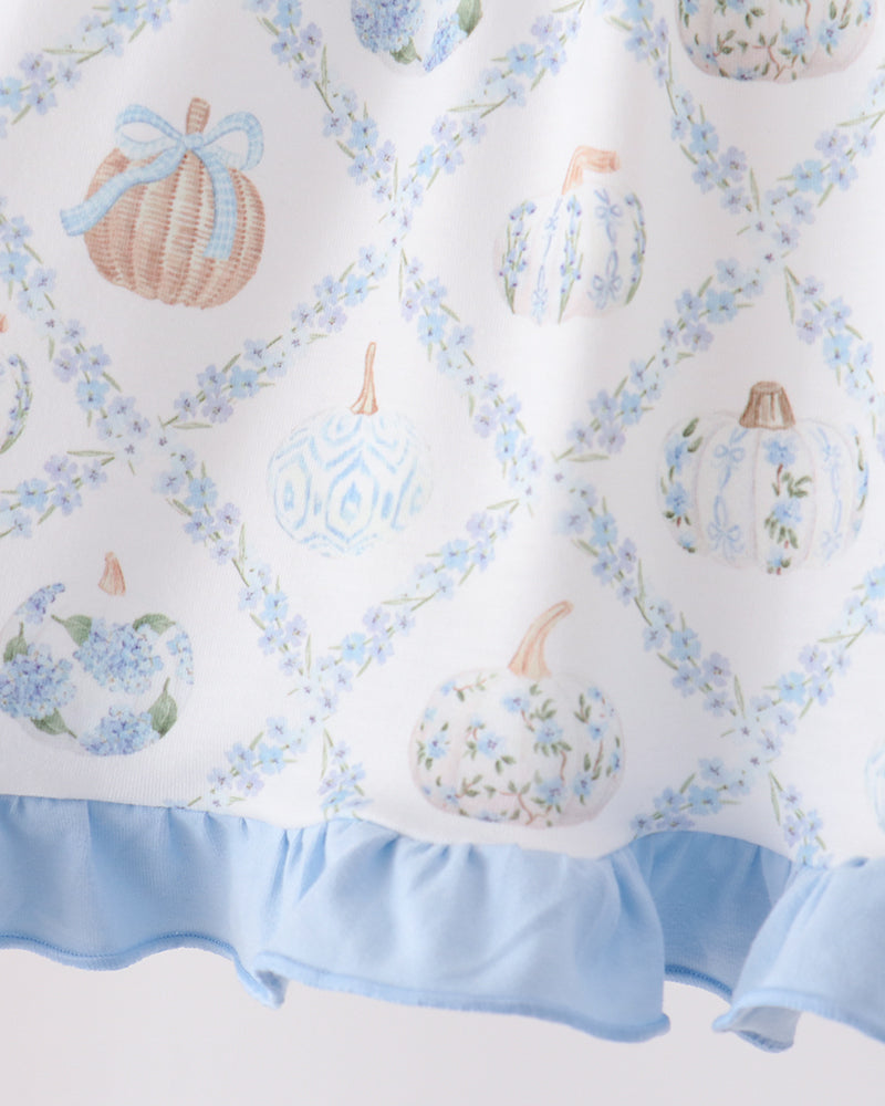 Light blue ruffle hem dress with scattered pumpkin motifs in an allover print.