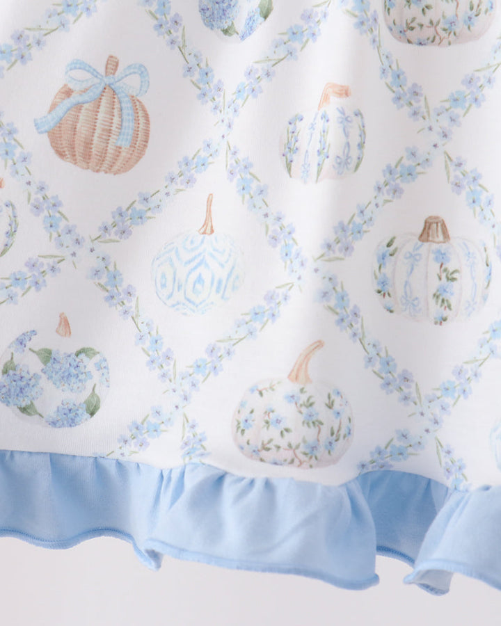 Light blue ruffle hem dress with scattered pumpkin motifs in an allover print.