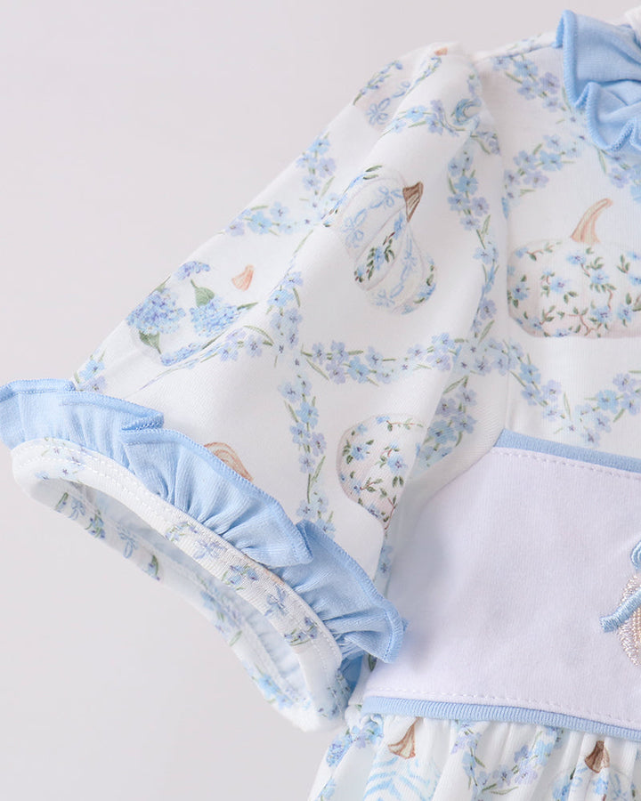 Blue-and-white ruffle-sleeve dress top with gathered waist and pastel pumpkin print