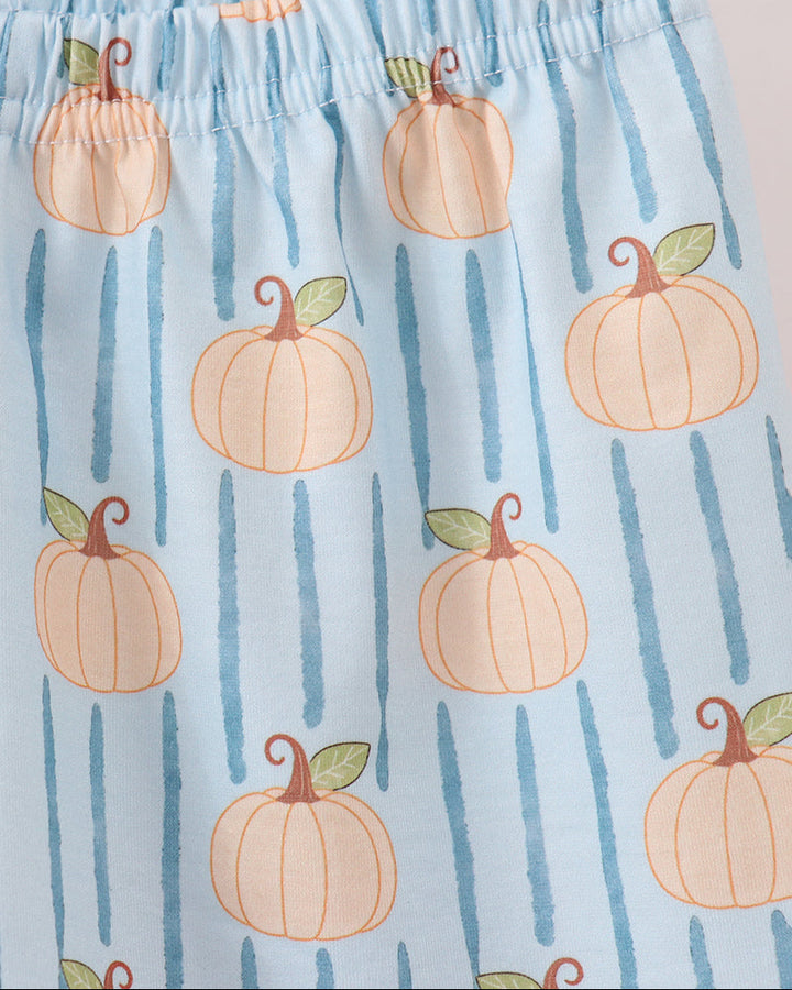 Light blue fabric with a repeating pattern of orange pumpkins and vertical blue stripes, featuring an elastic waistband.