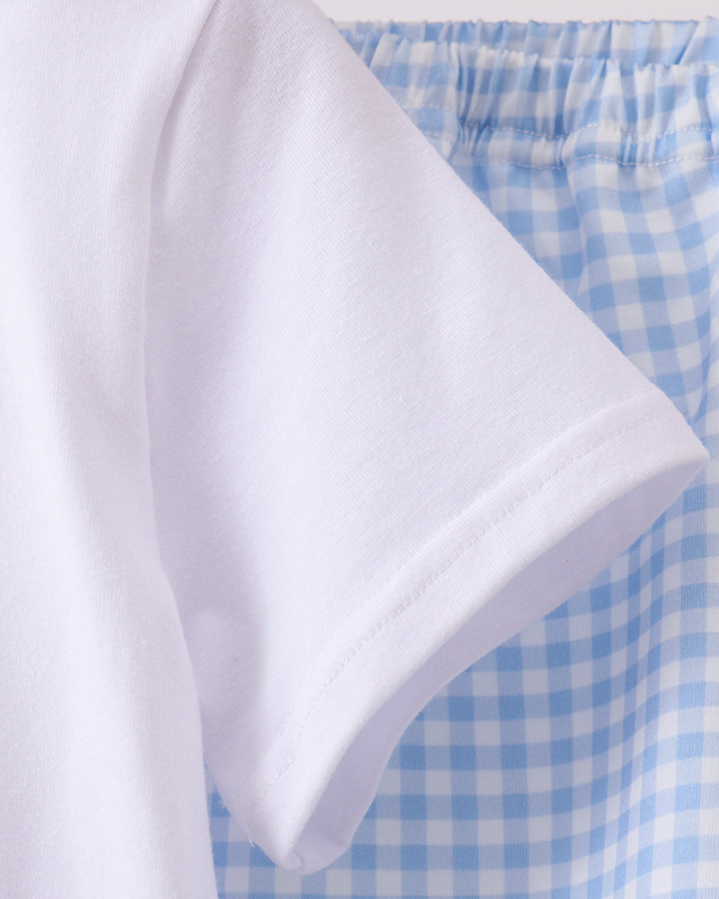 White T-shirt side and sleeve with blue gingham shorts waistband and elastic