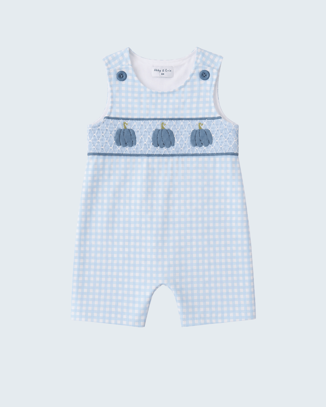A baby romper in a light blue and white gingham pattern, featuring a decorative chest band with three embroidered blue pumpkins and blue snap buttons on the shoulders, shown against a light gray background.