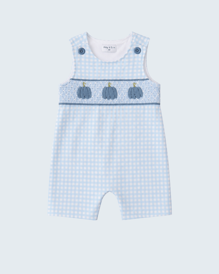 A baby romper in a light blue and white gingham pattern, featuring a decorative chest band with three embroidered blue pumpkins and blue snap buttons on the shoulders, shown against a light gray background.