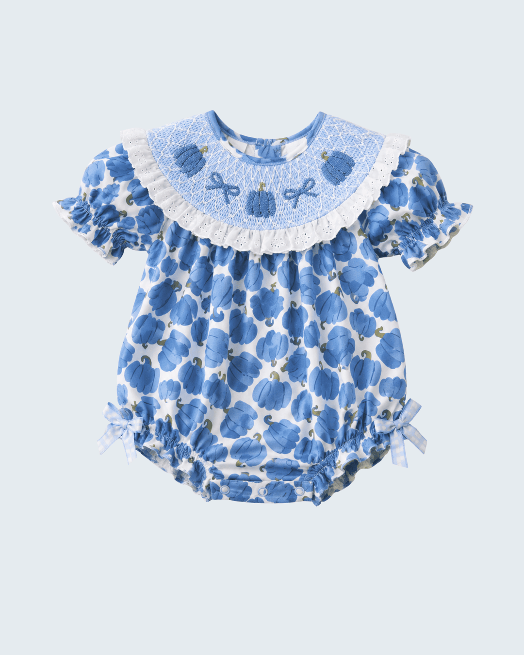 Light blue pumpkin-print bubble romper with white lace collar, gathered waist, bow ties