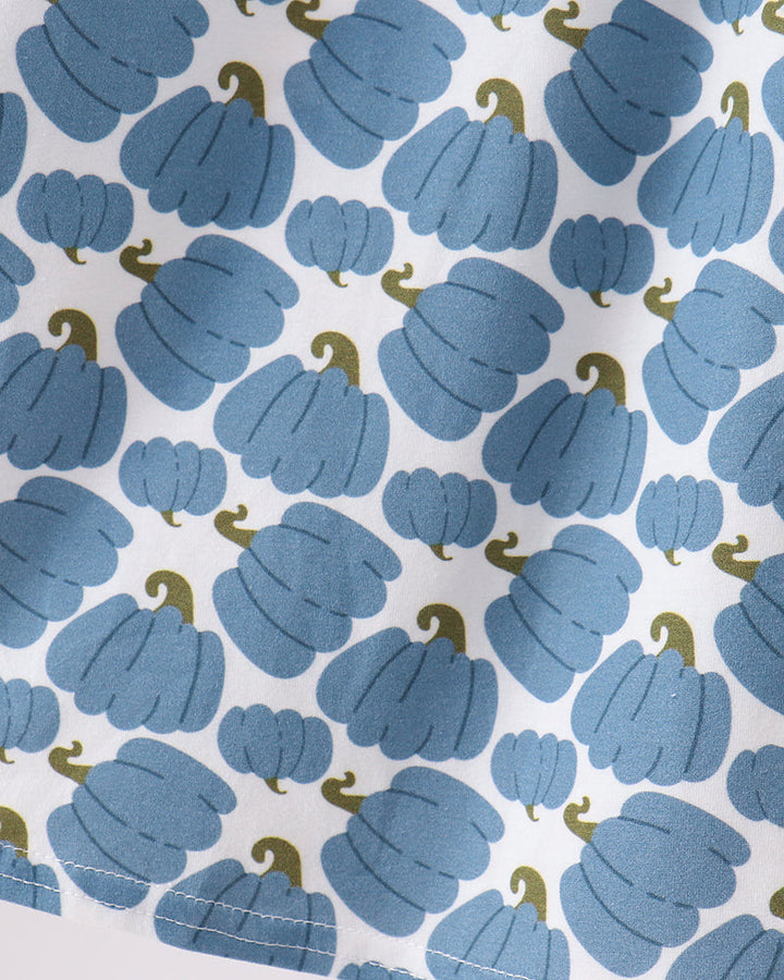 Blue pumpkin-themed fabric print with scalloped smocked yoke detail