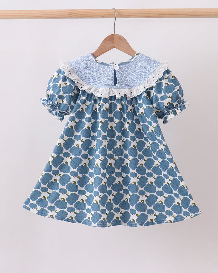 Blue pumpkin print baby dress with round lace-trimmed collar and flutter sleeves