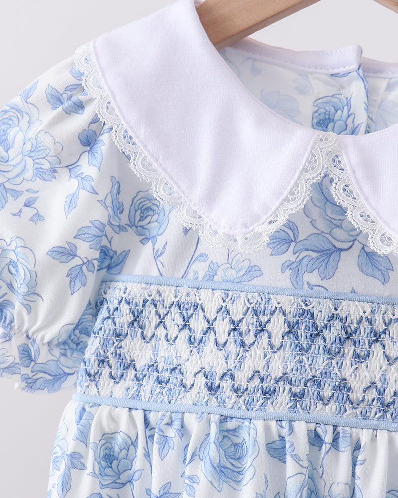 Close up of dress with white collar on wooden hanger