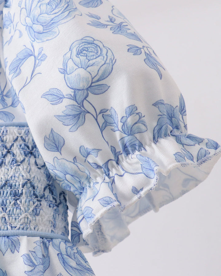 Close up of floral sleeve on light grey background
