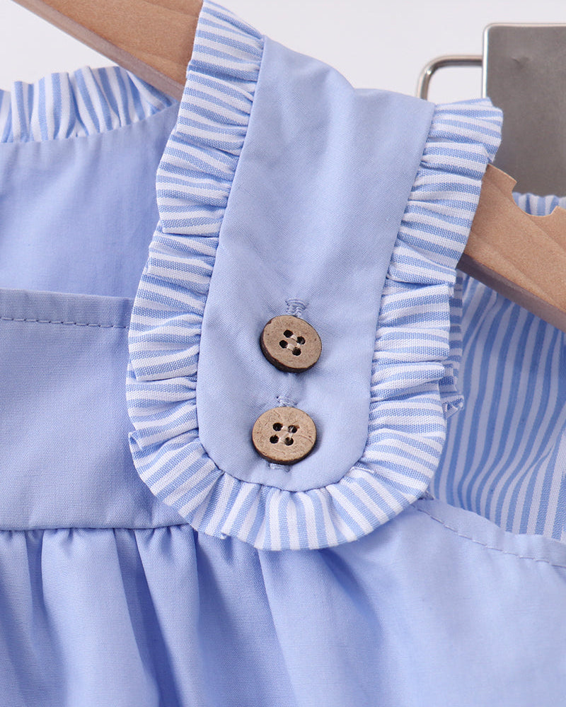 Light blue dress with ruffled collar and button closures, matching bloomer set