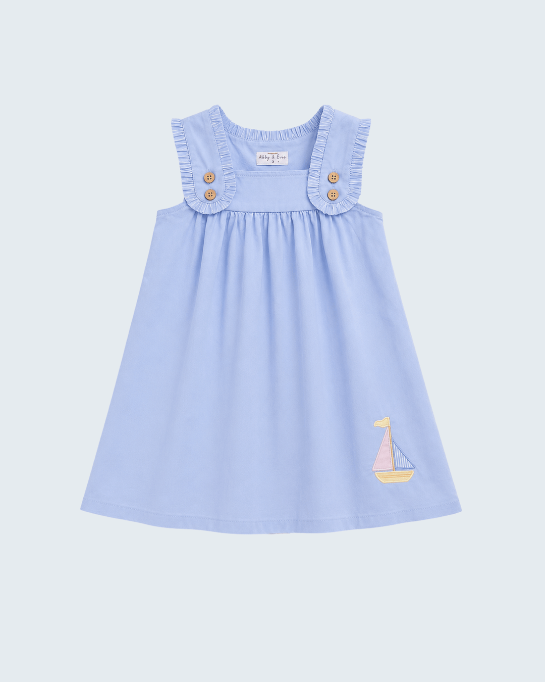 Light blue sleeveless dress with ruffled shoulders, button placket, sailboat embroidery