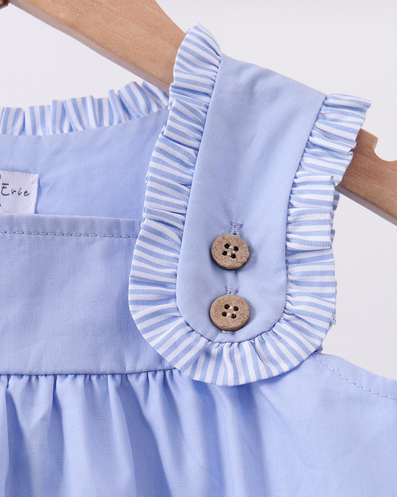 Light blue sleeveless dress with buttoned shoulder strap and striped ruffle trim