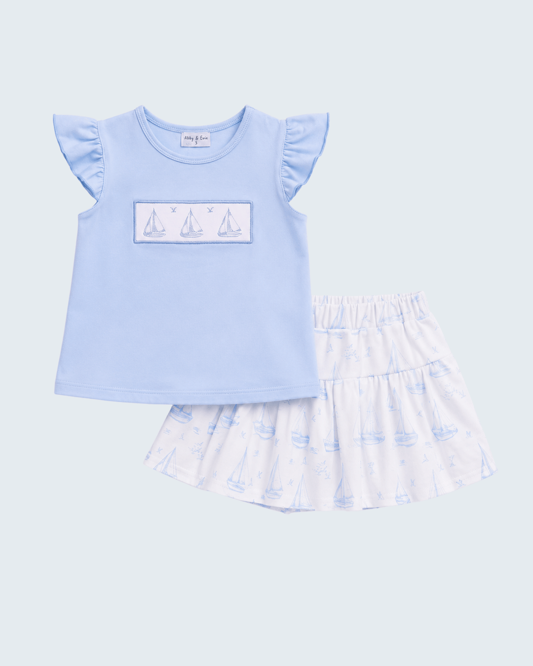 Light blue baby skorts set: embroidered sailboat top with printed skirt bottom