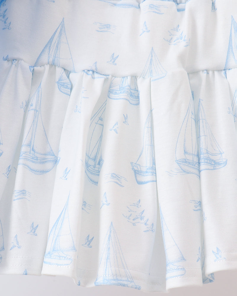 White tiered skort with blue sailboat print and gathered waistband