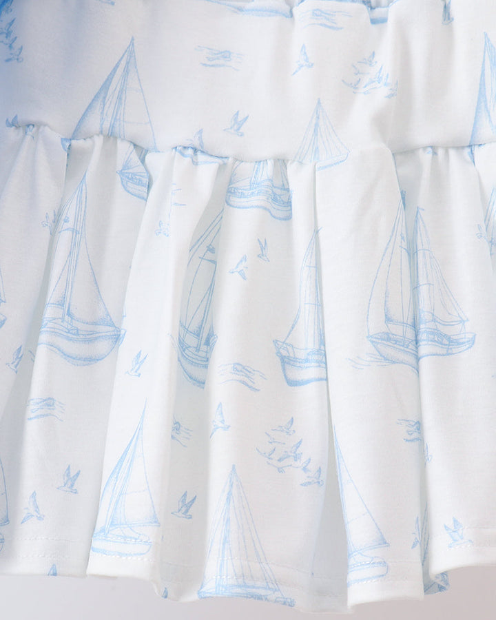 White tiered skort with blue sailboat print and gathered waistband