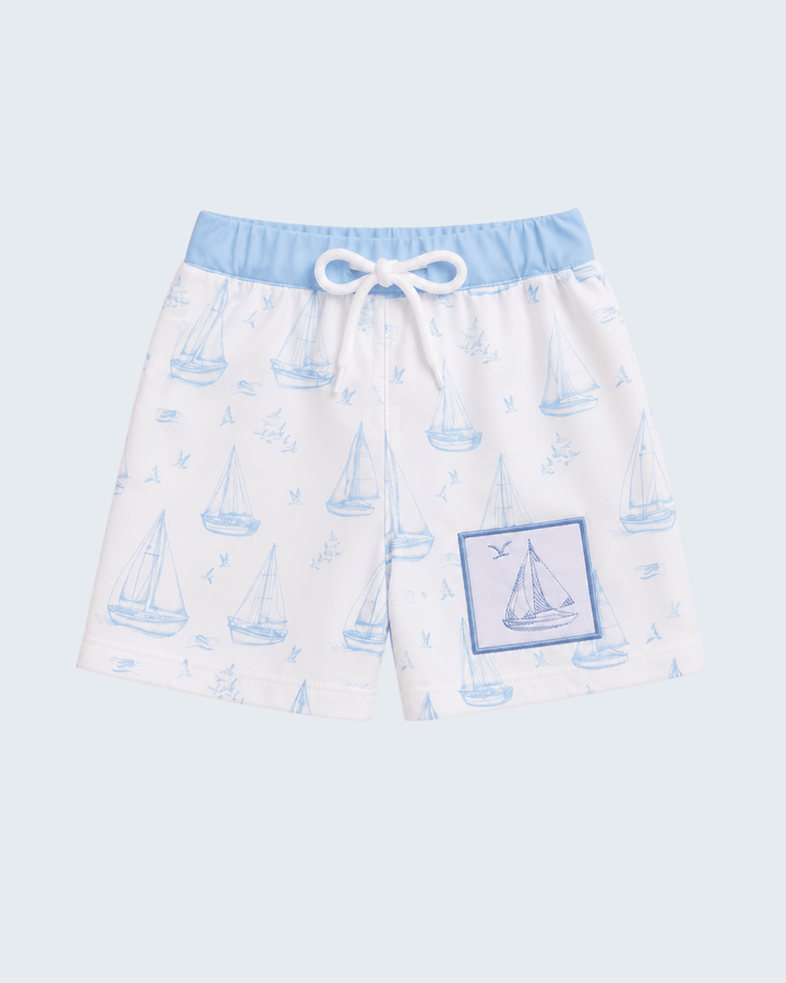 Kids swim trunks with light blue sailboat print, elastic waistband and drawstring