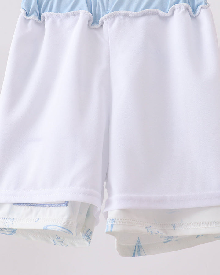 White swim shorts with light blue trim, elastic waistband and hem