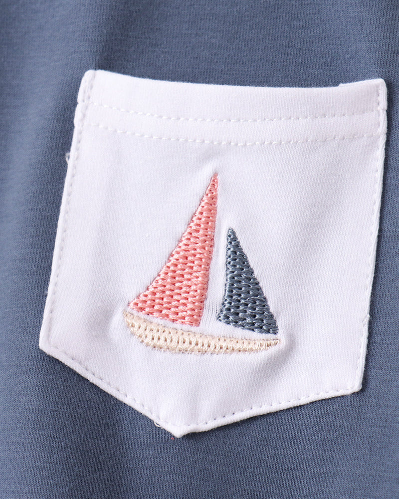 Embroidered sailboat on white pocket
