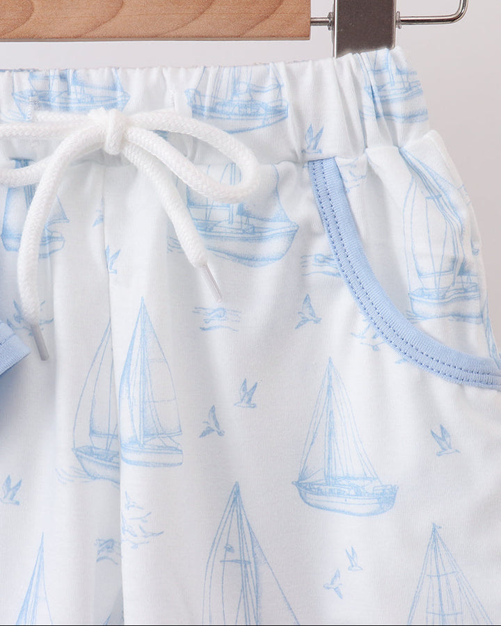 Matching sailboat print shorts with blue drawstring and elastic waistband
