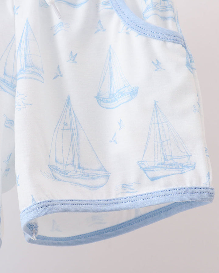 Sailboat print shorts hem with light blue trim