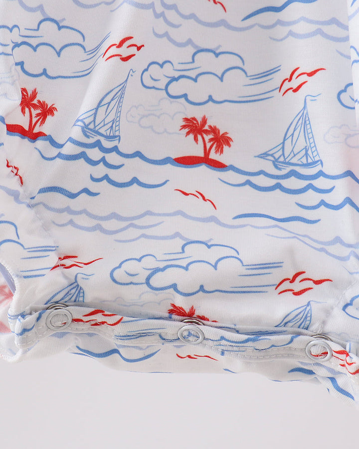 Fabric with nautical pattern featuring sailboats, palm trees, and clouds on a white background.