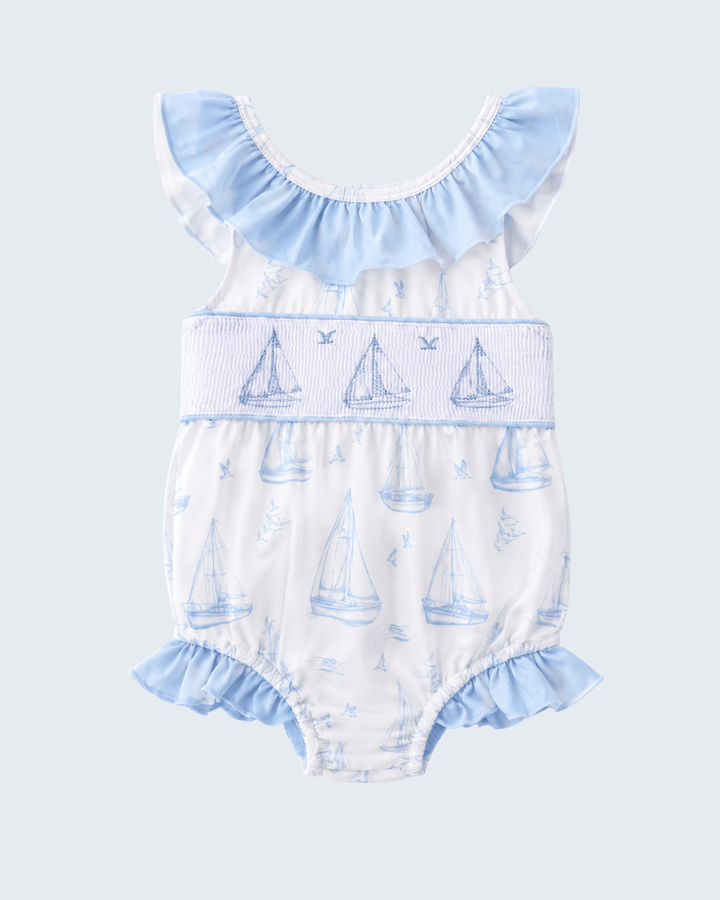 Blue Sailboat Smocked One-Piece Swimsuit on light blue background