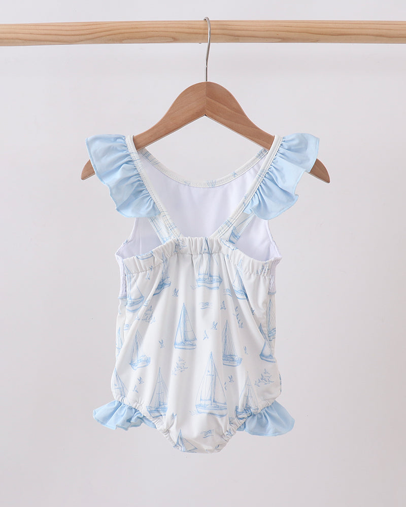 Blue Sailboat Smocked One-Piece Swimsuit on wooden hanger