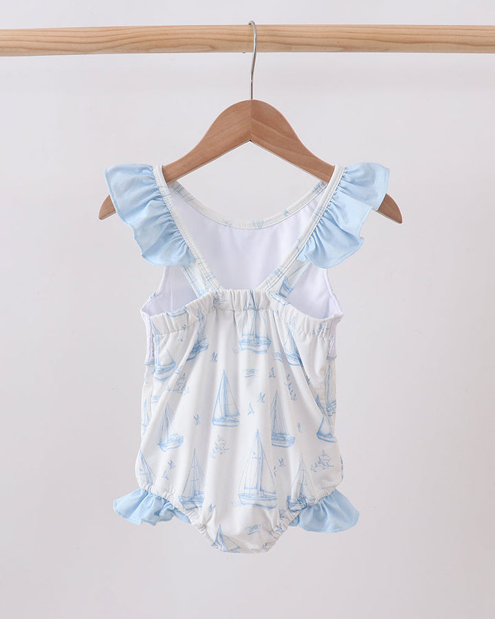 Blue Sailboat Smocked One-Piece Swimsuit on wooden hanger