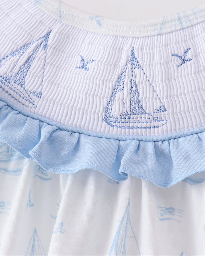 Smocked sailboat printed romper