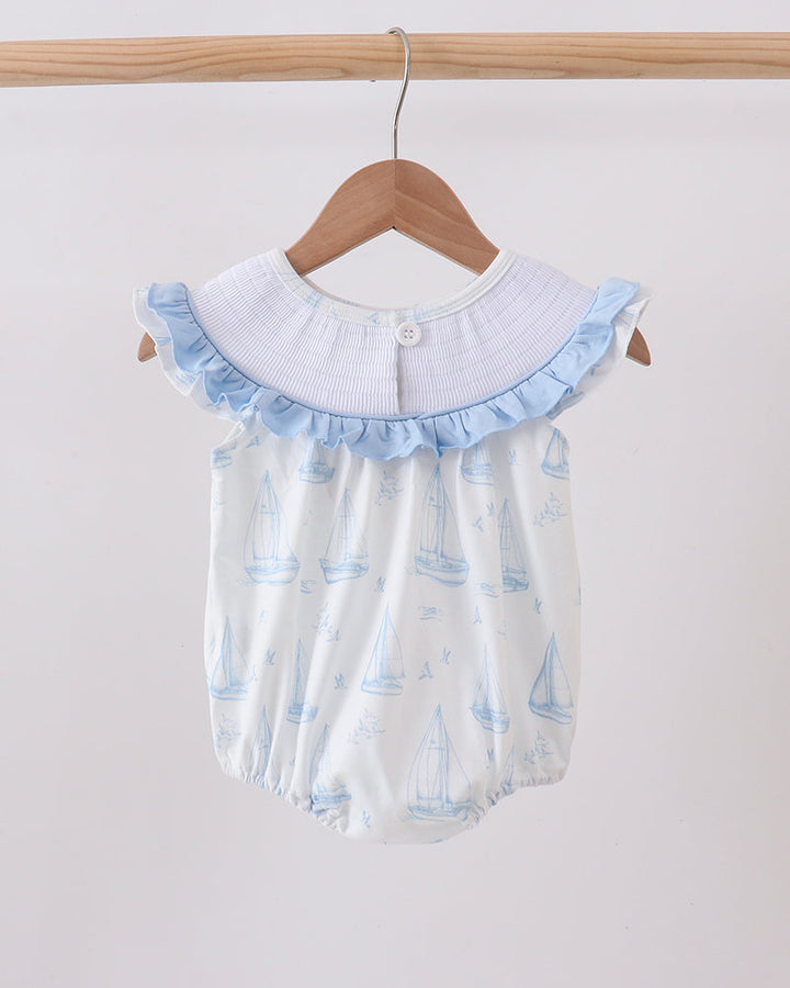 Blue Sailboat Smocked Ruffle Bubble on wooden hanger