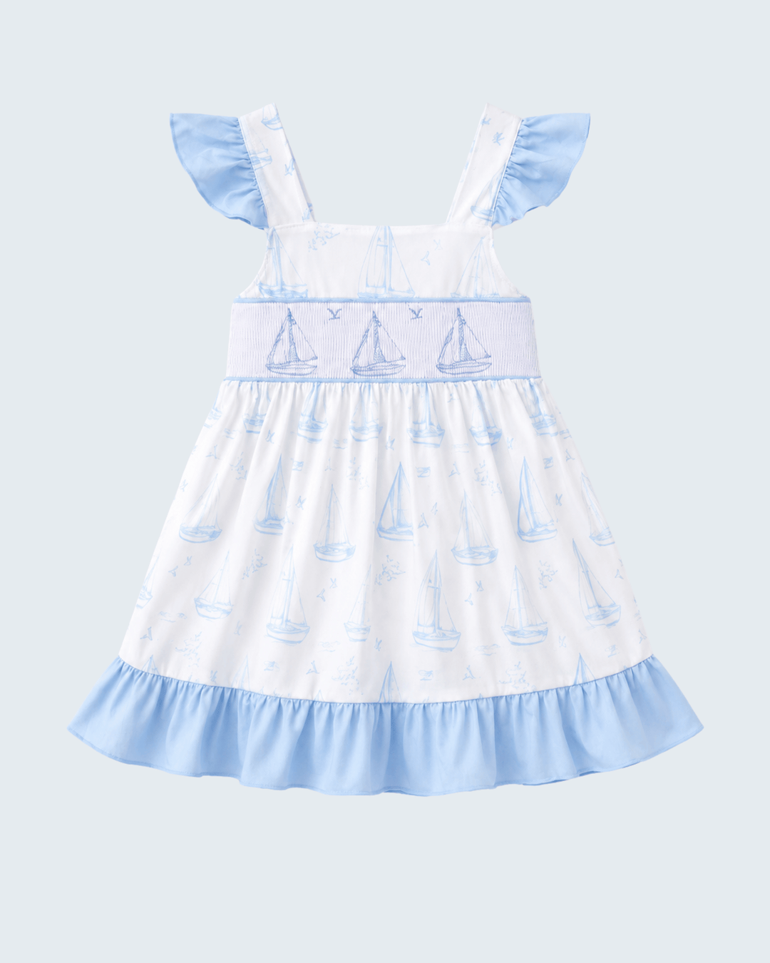 Blue Sailboat Smocked Ruffle Dress on light blue background