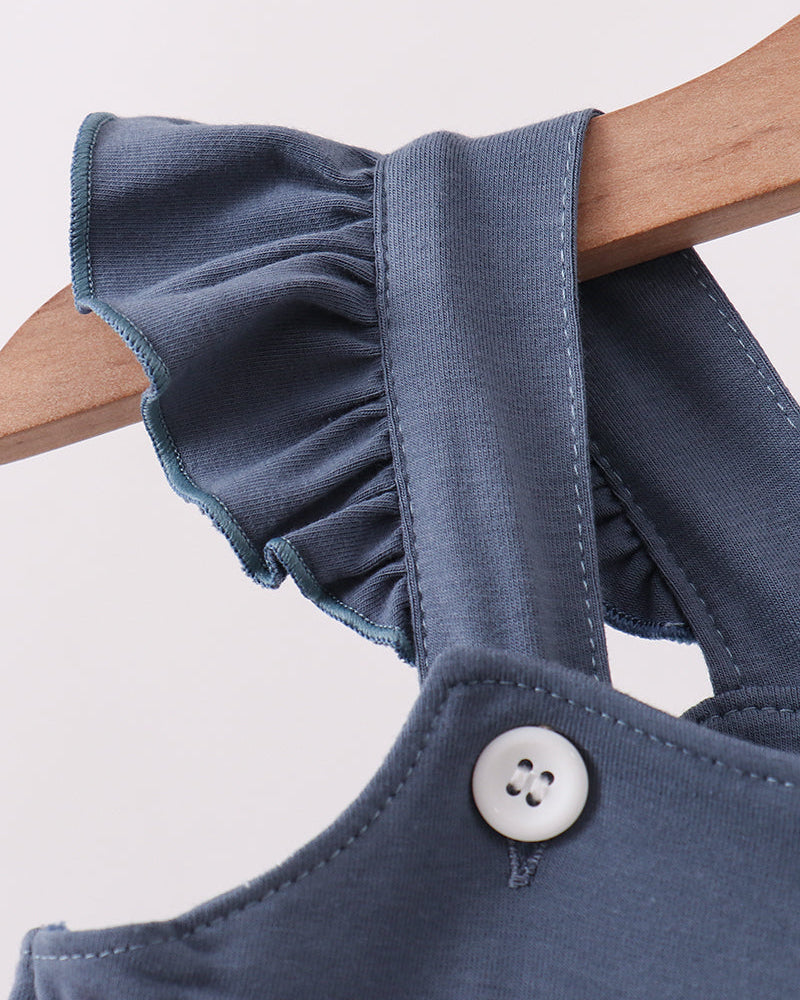 Ruffle cap sleeves on blue fabric