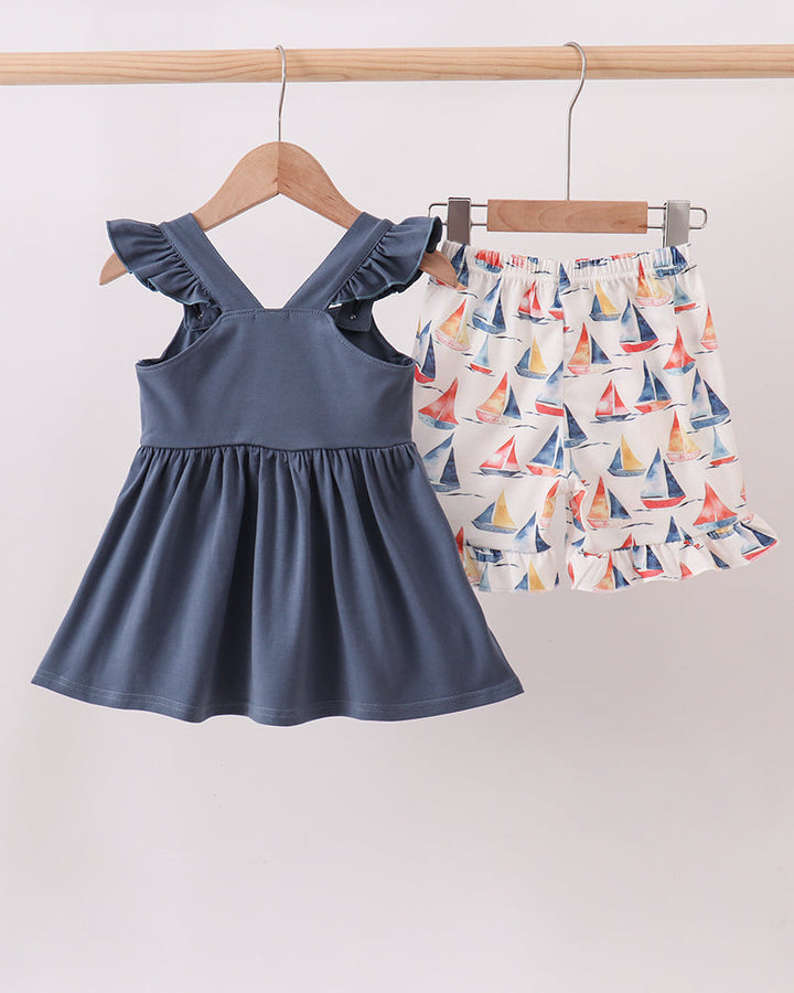 Blue Sailboat Smocked Ruffle Shorts Set on wooden hanger