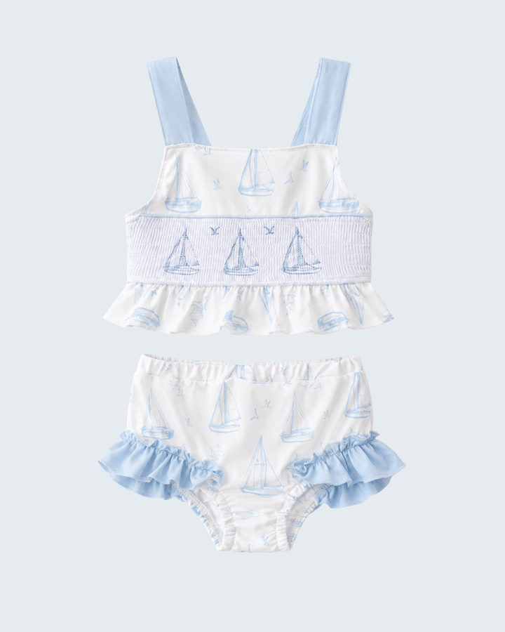 Blue Sailboat Smocked Two-Piece Swimsuit on light grey background