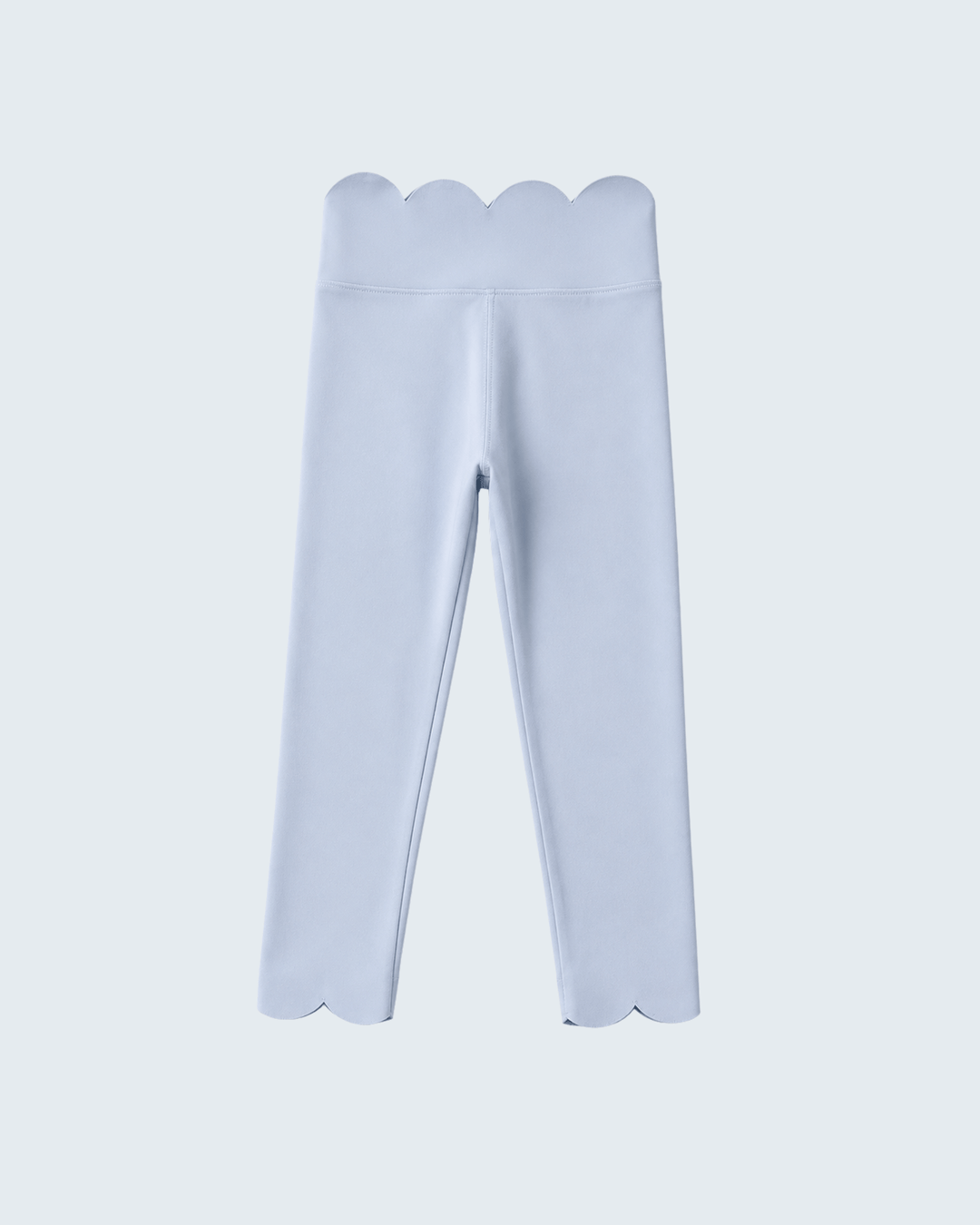 Light blue leggings with scalloped edges on a light gray background