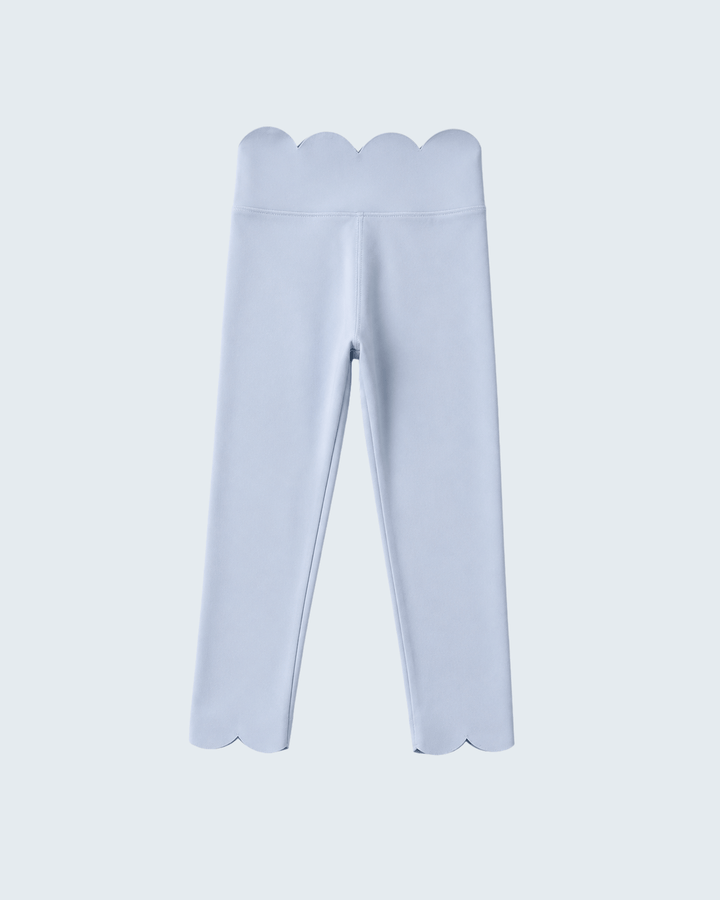 Light blue leggings with scalloped edges on a light gray background