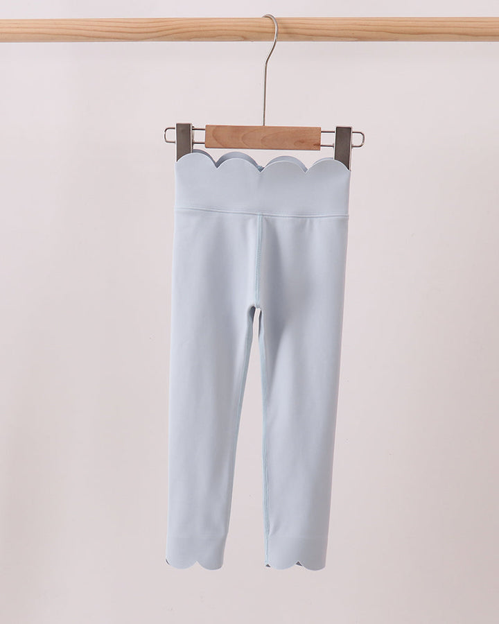 Blue Scalloped Yoga Active Leggings on wooden hanger. Light grey background