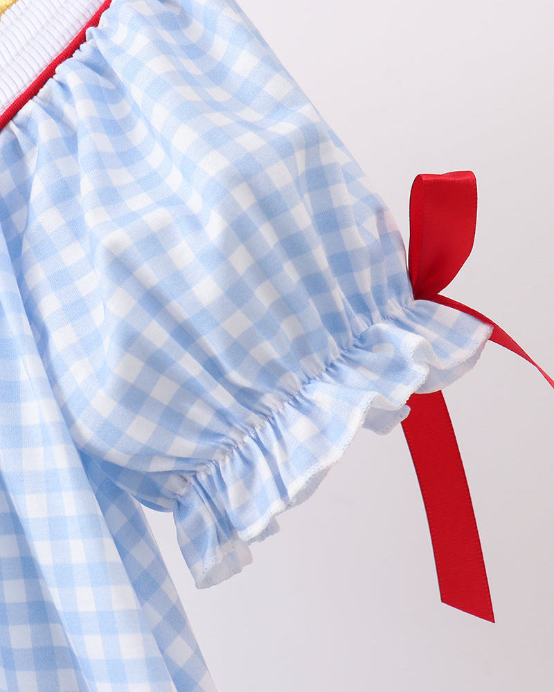 Blue gingham sleeve with a red bow