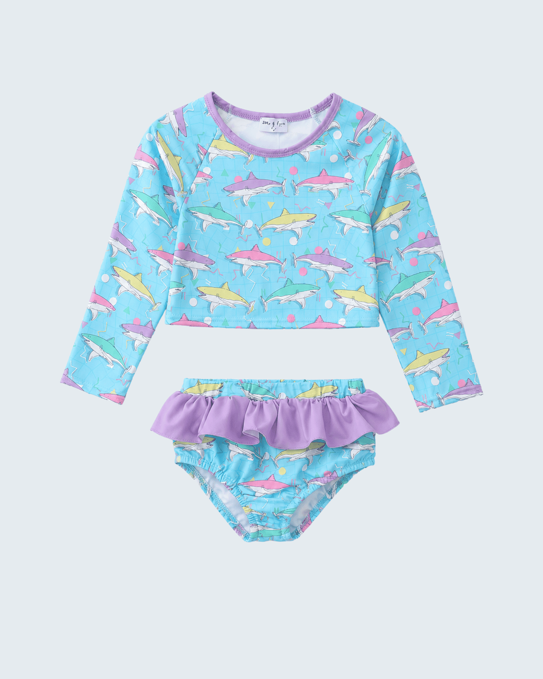 Children's two-piece swimsuit with shark pattern on a light blue background