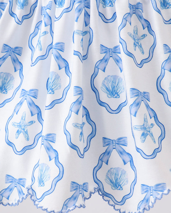 White fabric with blue shell and starfish pattern