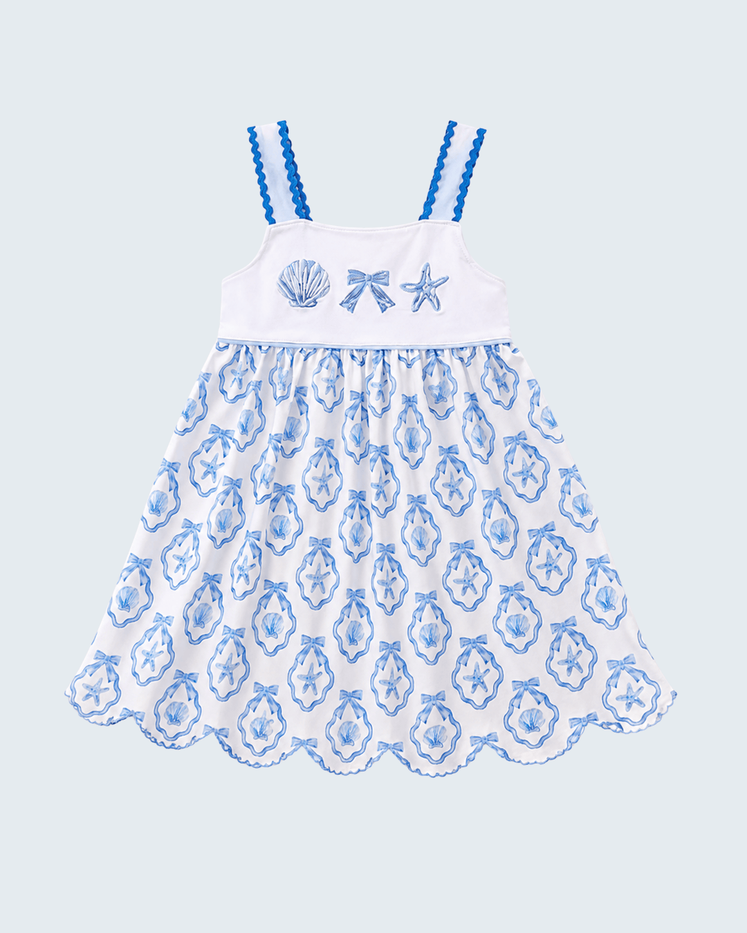 White dress with blue floral pattern and starfish design on a light blue background