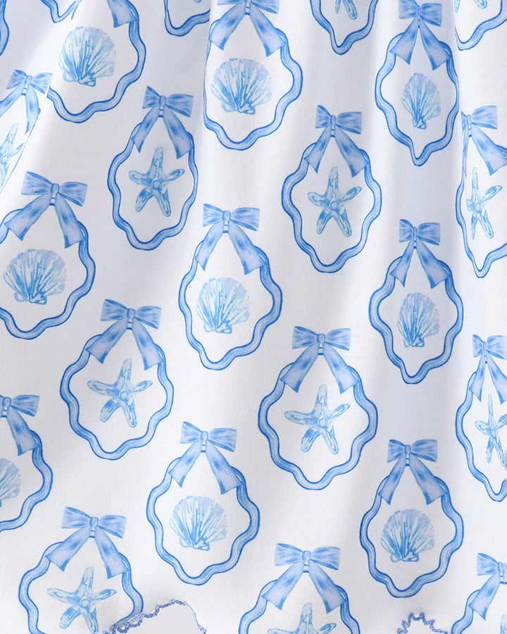 White fabric with blue shell and starfish pattern
