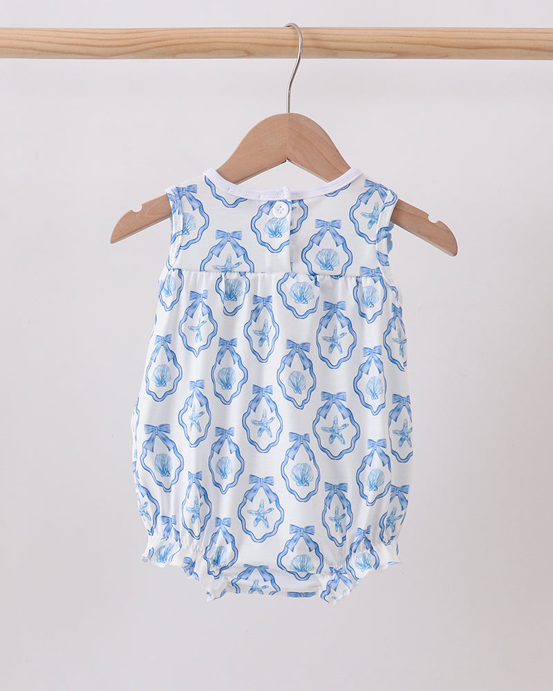Baby dress romper against a white background