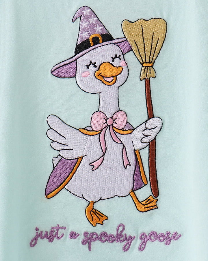 Goose witch applique with bow, wand, and purple text on mint bubble romper